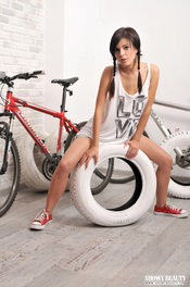 Sporty Girl Posing With Her Bicycle 19