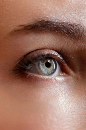 The petite brunette admiring her reflection on a television screen gyrates slowly to the rock song throbbing through the room as 20